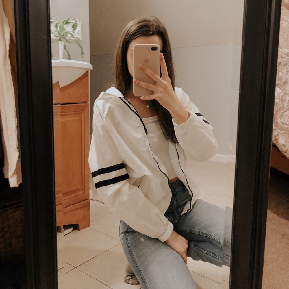 white windbreaker